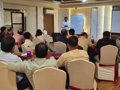 In-room capital markets training session with participants
